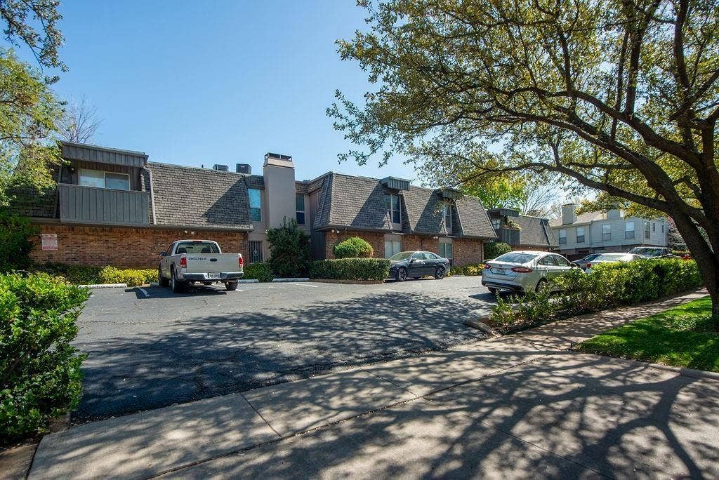 4112 Bowser Avenue, #210, Dallas, TX 75219 Brick and siding exterior with pitched shingle roofs