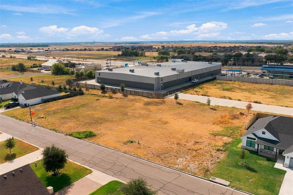 9928 Bridlewood Lane, Waco, TX 76708 Expansive undeveloped land parcel with direct paved road frontage
