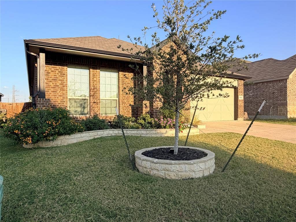 3308 Chasemoor Drive, Denton, TX 76207 Brick exterior with a covered entry