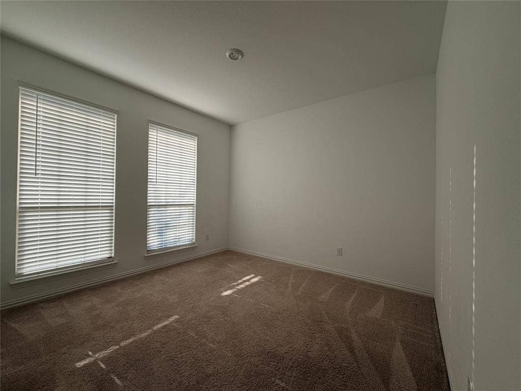 3308 Chasemoor Drive, Denton, TX 76207 Room with two windows, carpet flooring, a recessed ceiling light, and white painted walls