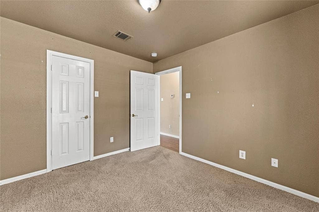 624 Willow Creek Drive, Hewitt, TX 76643 Carpeted flooring, neutral wall tones, white trim, and white paneled doors