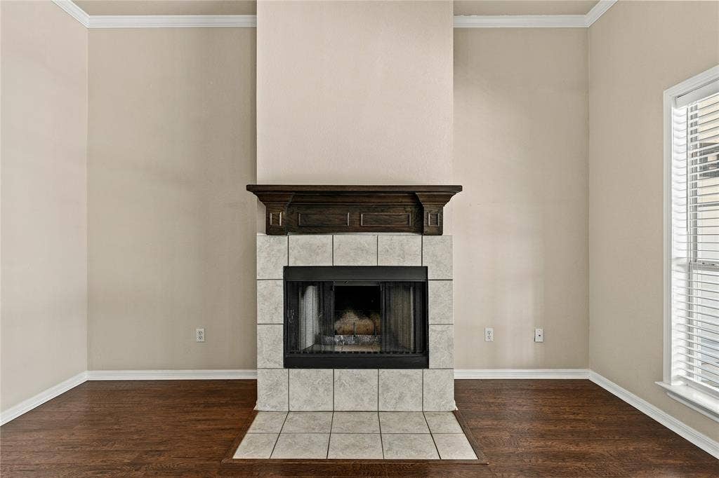 624 Willow Creek Drive, Hewitt, TX 76643 Fireplace featuring a tile surround, dark wood mantel, and a firebox