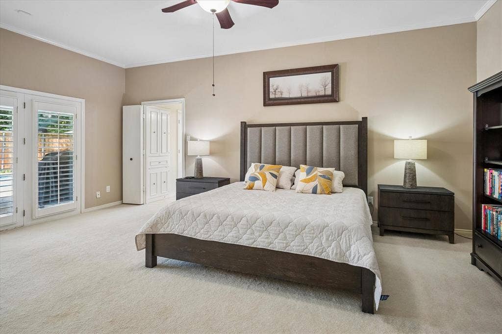 7603 Queens Ferry Lane, Dallas, TX 75248 Ceiling fan with light fixture, light-colored carpeting, white paneled double doors, white interior door, and neutral wall paint