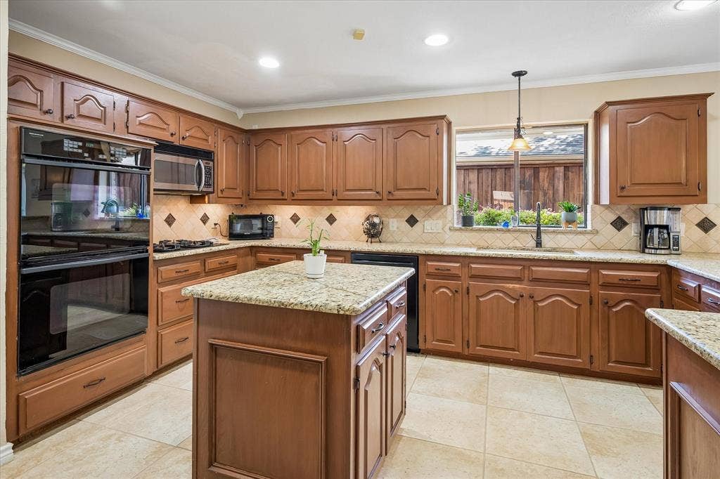 7603 Queens Ferry Lane, Dallas, TX 75248 Kitchen featuring wood cabinetry, granite countertops, tile flooring, a built-in double oven, and a central island