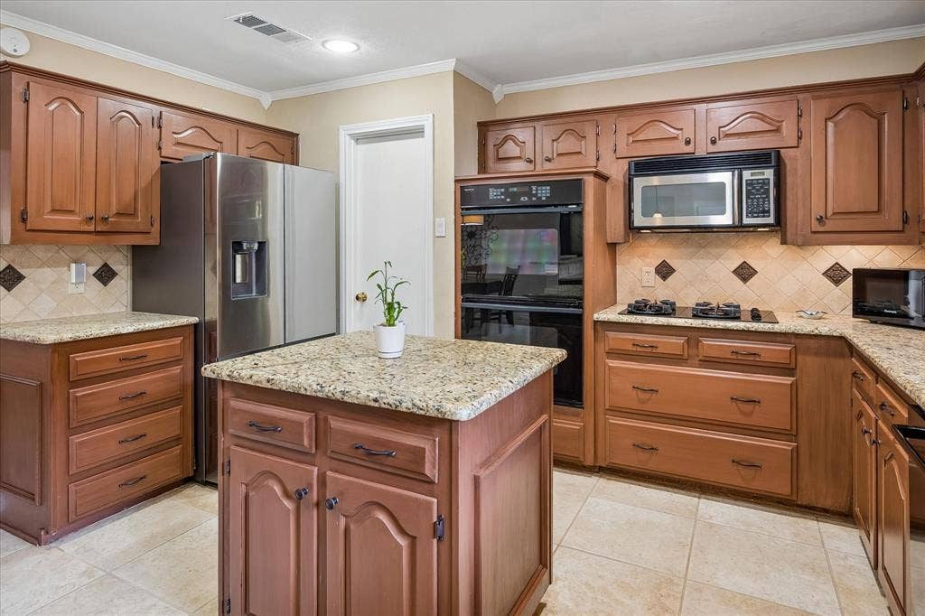 7603 Queens Ferry Lane, Dallas, TX 75248 Kitchen featuring wood cabinetry, light-toned granite countertops, a built-in double oven, and a built-in microwave
