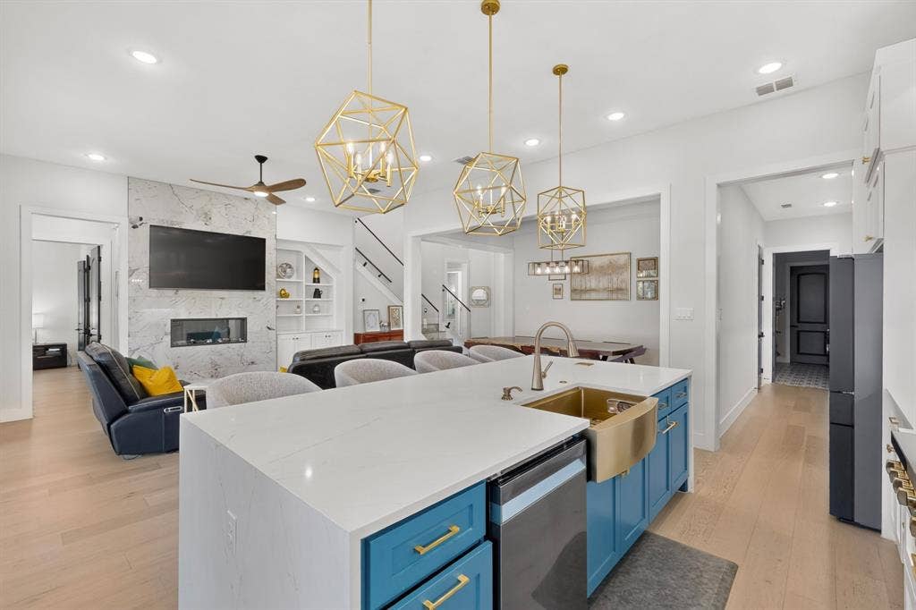 2519 Tamaron Cove, Cedar Hill, TX 75104 Gourmet kitchen with a large central island, gold-tone fixtures, and pendant lighting