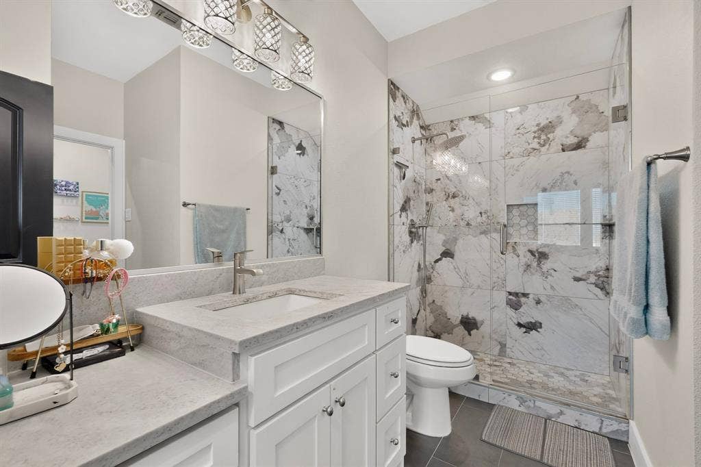 2519 Tamaron Cove, Cedar Hill, TX 75104 White vanity with an integrated sink and light-toned countertop