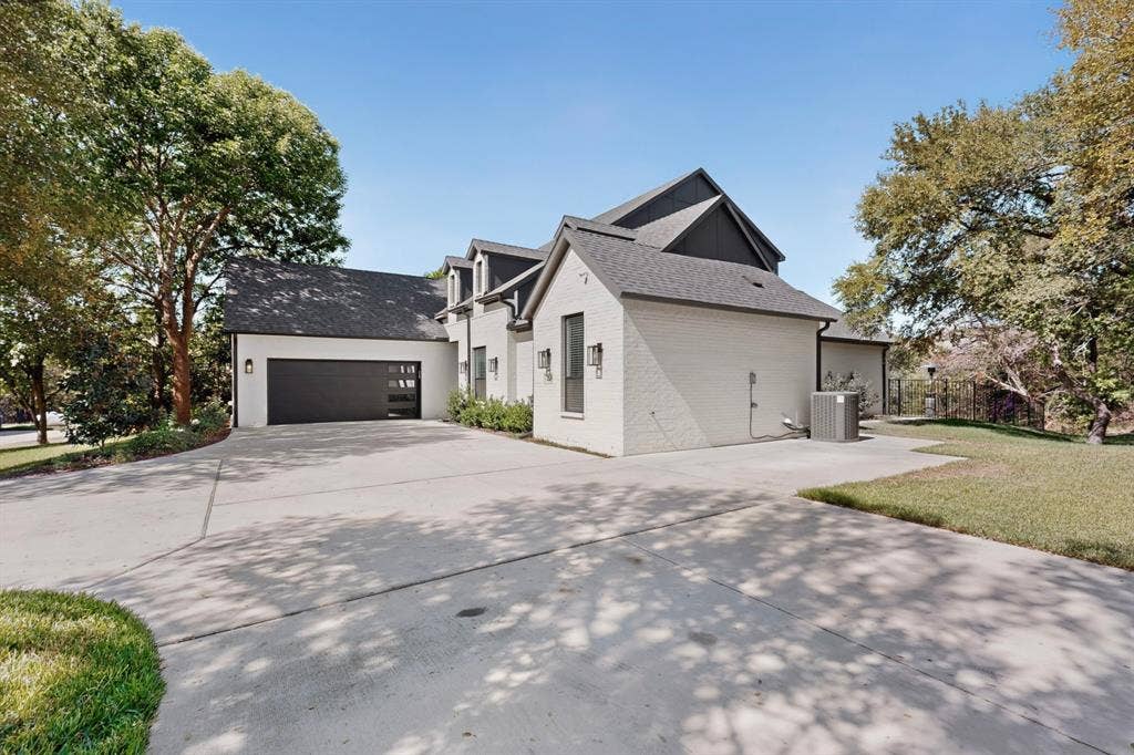 2519 Tamaron Cove, Cedar Hill, TX 75104 White brick exterior with dark trim and roof