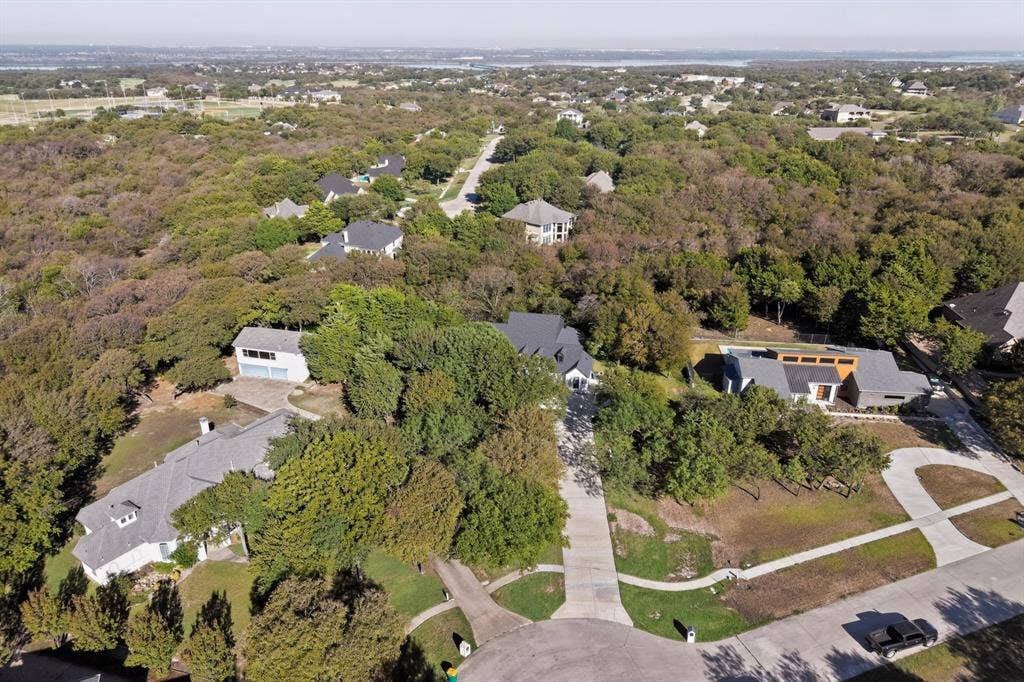 2519 Tamaron Cove, Cedar Hill, TX 75104 Expansive treed landscape featuring multiple properties with distinct architectural styles