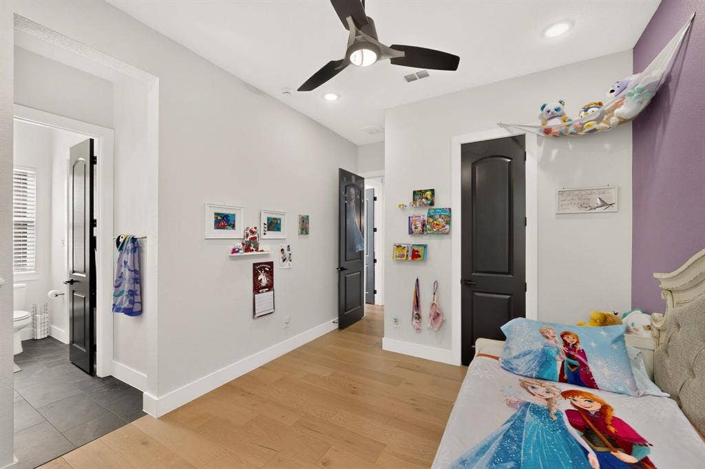 2519 Tamaron Cove, Cedar Hill, TX 75104 Light wood-finish flooring, recessed ceiling lighting, a ceiling fan, and a solid black interior door