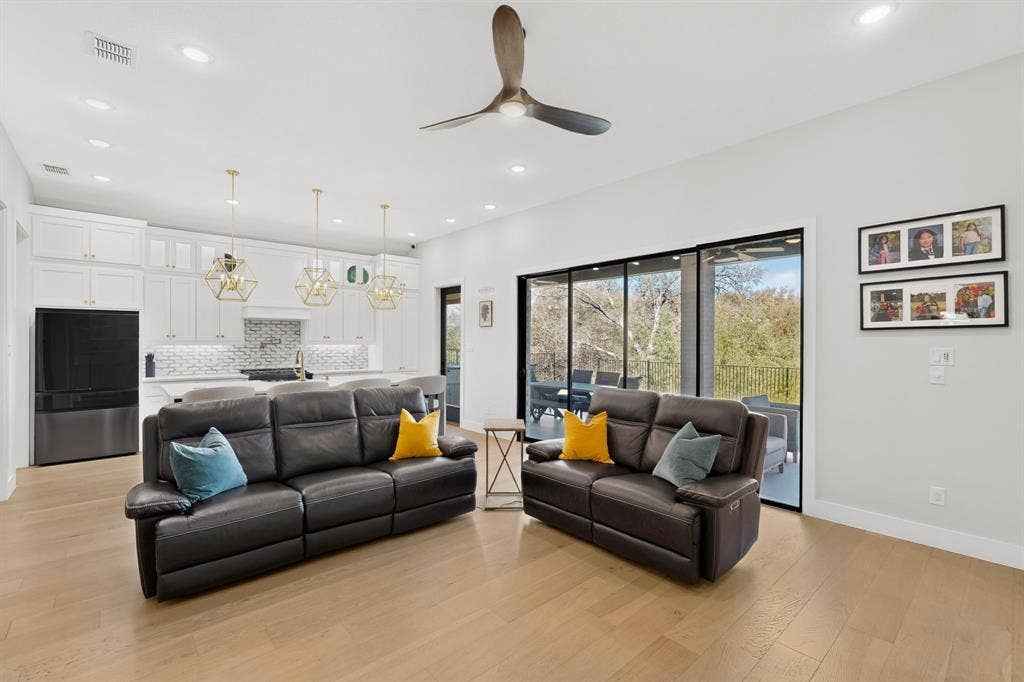 2519 Tamaron Cove, Cedar Hill, TX 75104 Open-concept living area with wood-finish flooring, recessed lighting, and a contemporary ceiling fan
