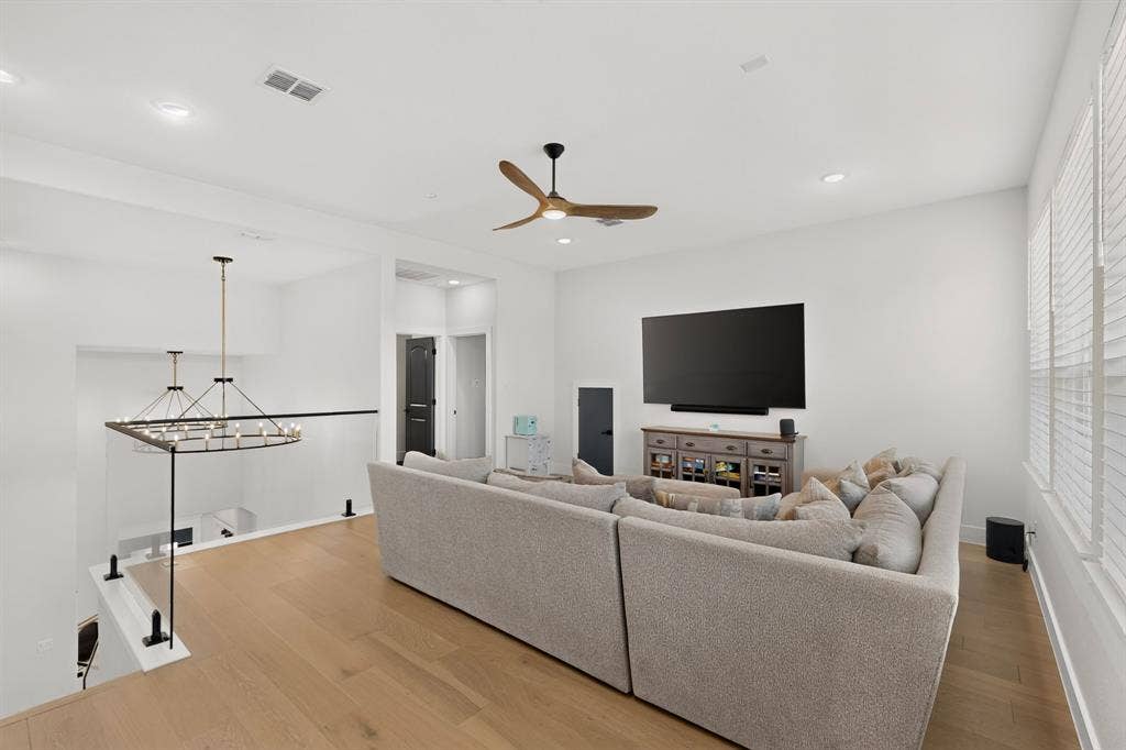 2519 Tamaron Cove, Cedar Hill, TX 75104 Expansive upper-level living space with wood-finish flooring, recessed lighting, and a modern ceiling fan