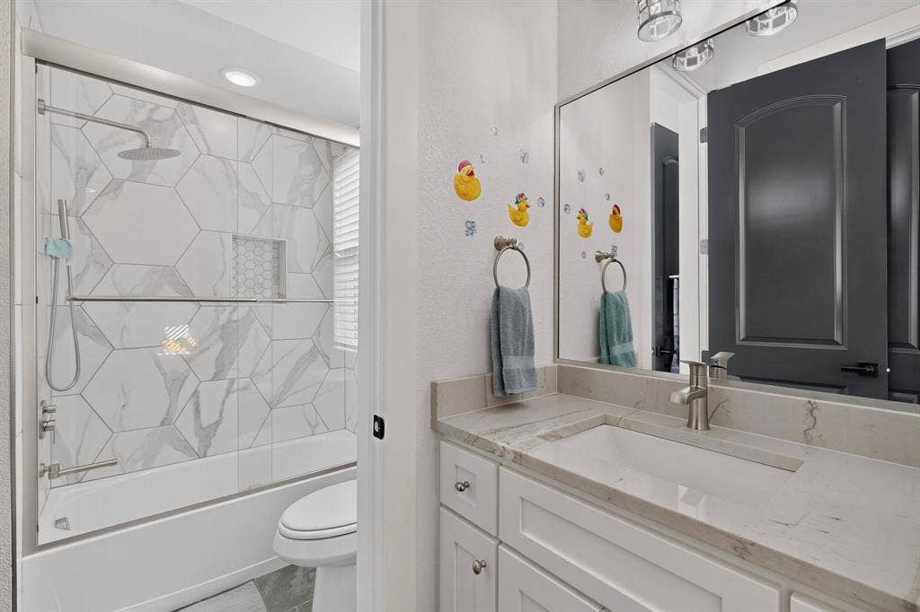 2519 Tamaron Cove, Cedar Hill, TX 75104 White vanity with an integrated rectangular sink and light-toned countertop