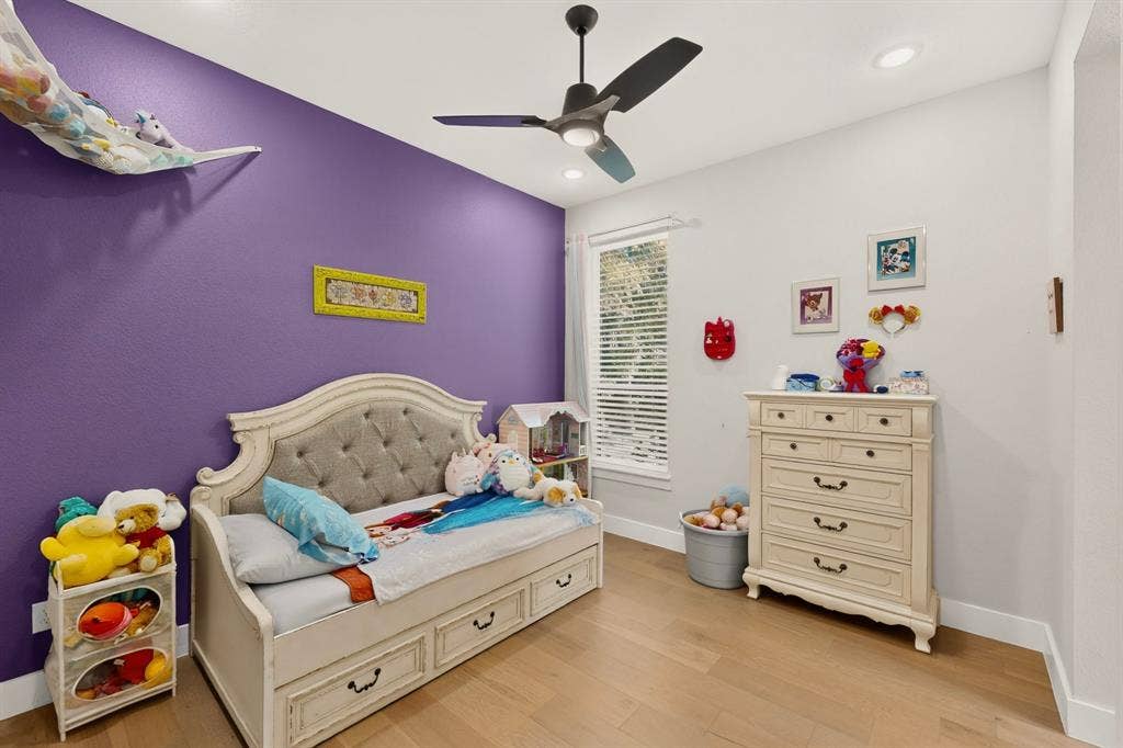 2519 Tamaron Cove, Cedar Hill, TX 75104 Wood-finish flooring, recessed lighting, and a modern ceiling fan with integrated lighting