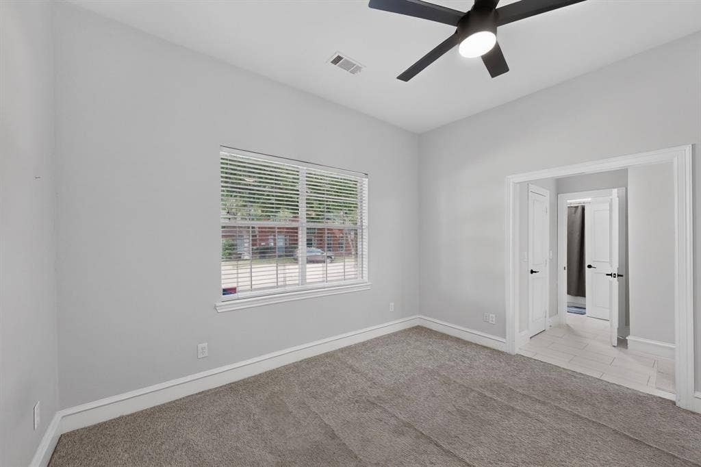 4237 McAlice Drive, Plano, TX 75093 Plush carpet flooring, neutral wall tones, window with horizontal blinds, contemporary ceiling fan with integrated lighting, and white trim