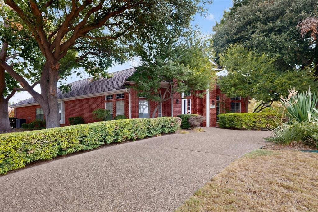 4237 McAlice Drive, Plano, TX 75093 Brick exterior with a tiled roof