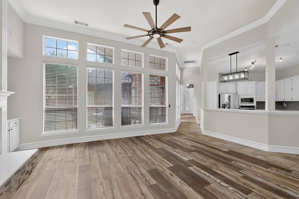 4237 McAlice Drive, Plano, TX 75093 Wood-finish flooring throughout, a vaulted ceiling, and a contemporary ceiling fan