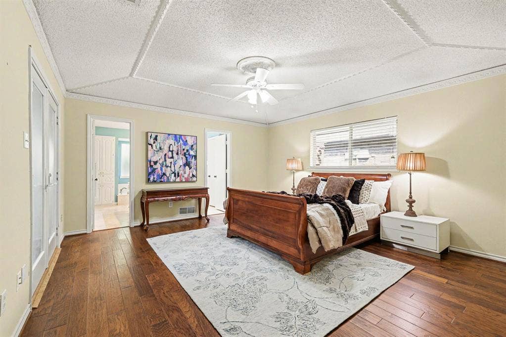 6503 Barfield Drive, Dallas, TX 75252 Hardwood-finish flooring, textured ceiling with decorative trim, white ceiling fan, and French doors