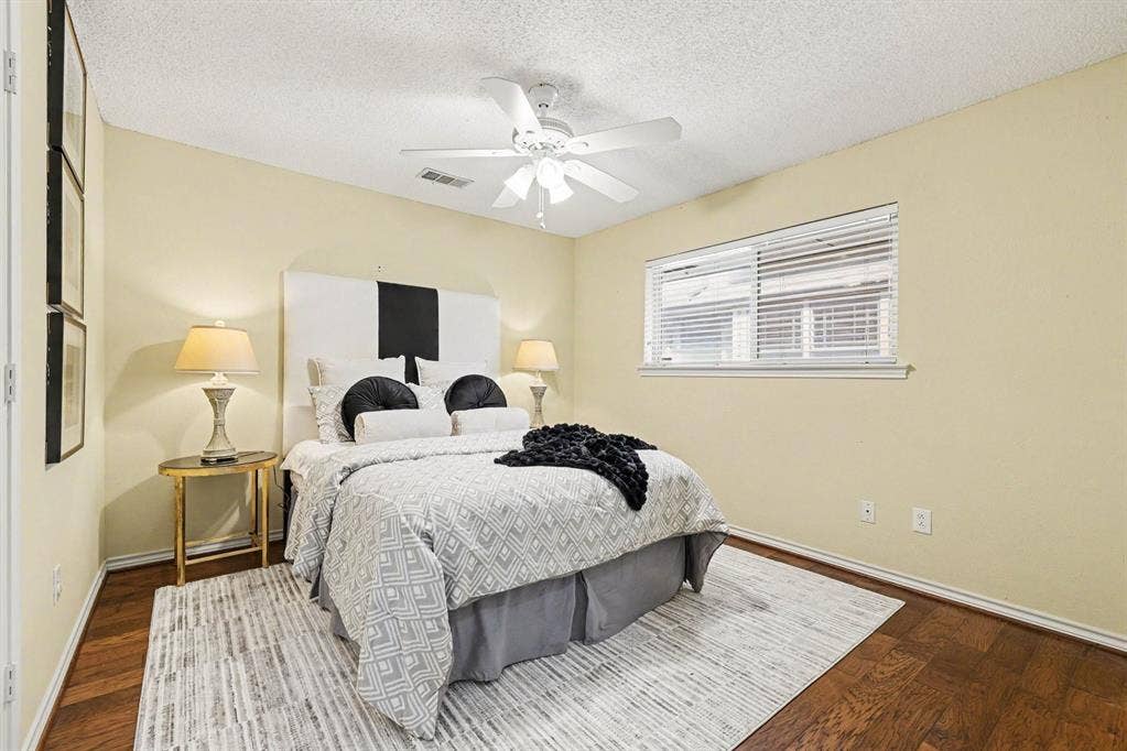 6503 Barfield Drive, Dallas, TX 75252 Wood-finish flooring, single window with blinds, ceiling fan, and light-toned walls