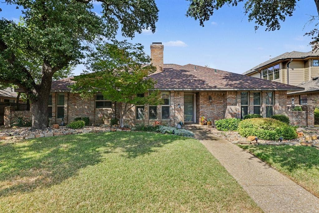 6503 Barfield Drive, Dallas, TX 75252 Brick exterior with a gabled roof and prominent chimney