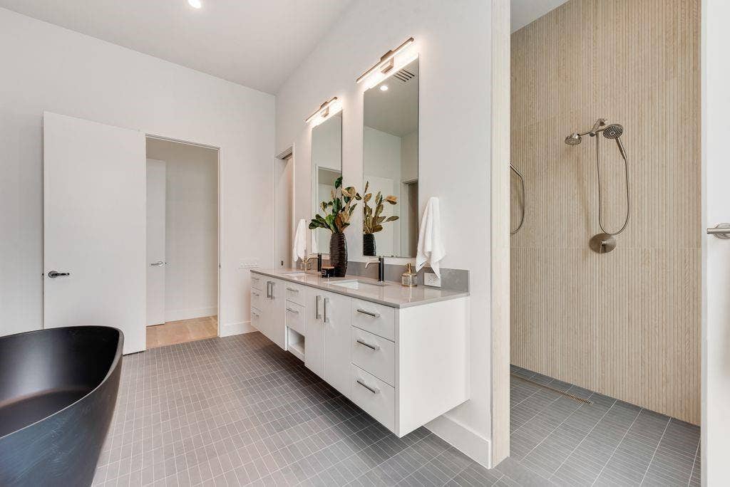 4103 Saranac Drive, Dallas, TX 75220 Dual vanities and a walk-in shower create a functional yet refined primary experience.