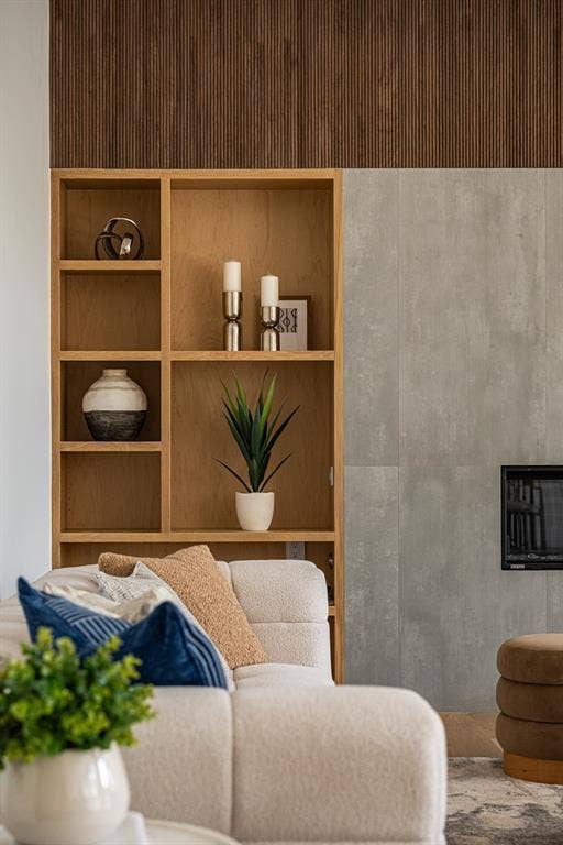 4103 Saranac Drive, Dallas, TX 75220 Custom built-in shelving, warm wood tones and fluted walnut accents create a striking architectural focal point, bringing texture and sophistication to the living space.