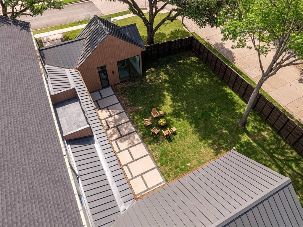 4103 Saranac Drive, Dallas, TX 75220 Set beneath a canopy of mature oaks and showcasing striking modern design.