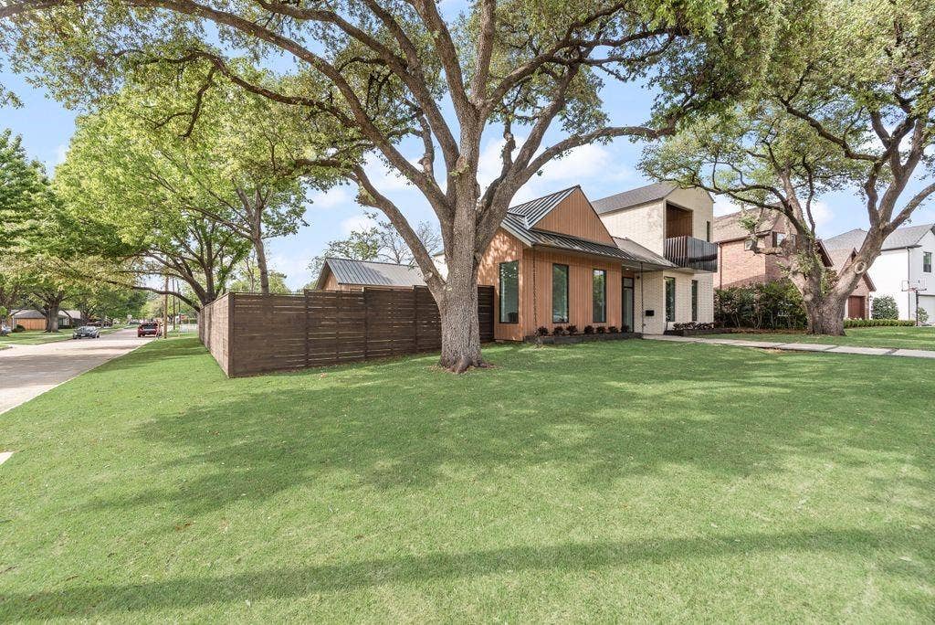 4103 Saranac Drive, Dallas, TX 75220 The exterior showcases clean architectural lines and a striking standing seam metal roof