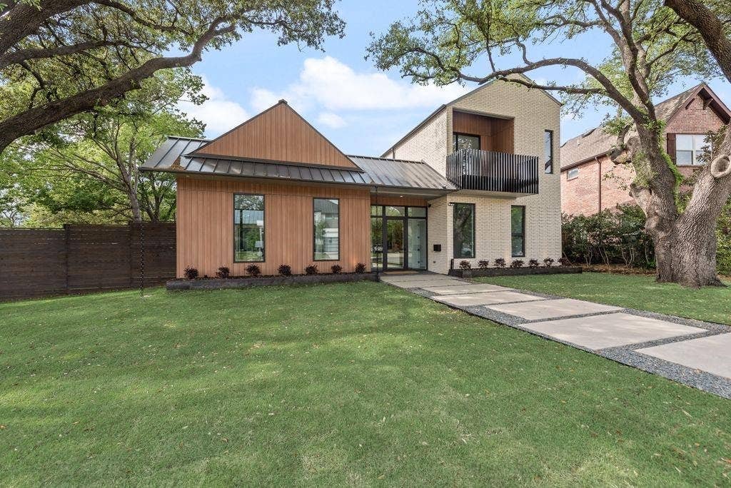 4103 Saranac Drive, Dallas, TX 75220 A thoughtful blend of brick and board & batten siding creates depth and visual interest.