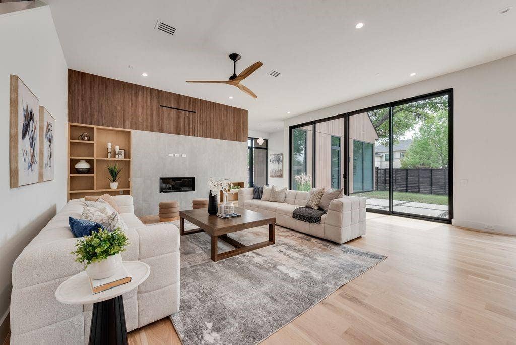 4103 Saranac Drive, Dallas, TX 75220 A statement fireplace anchors the space, adding warmth and architectural interest.