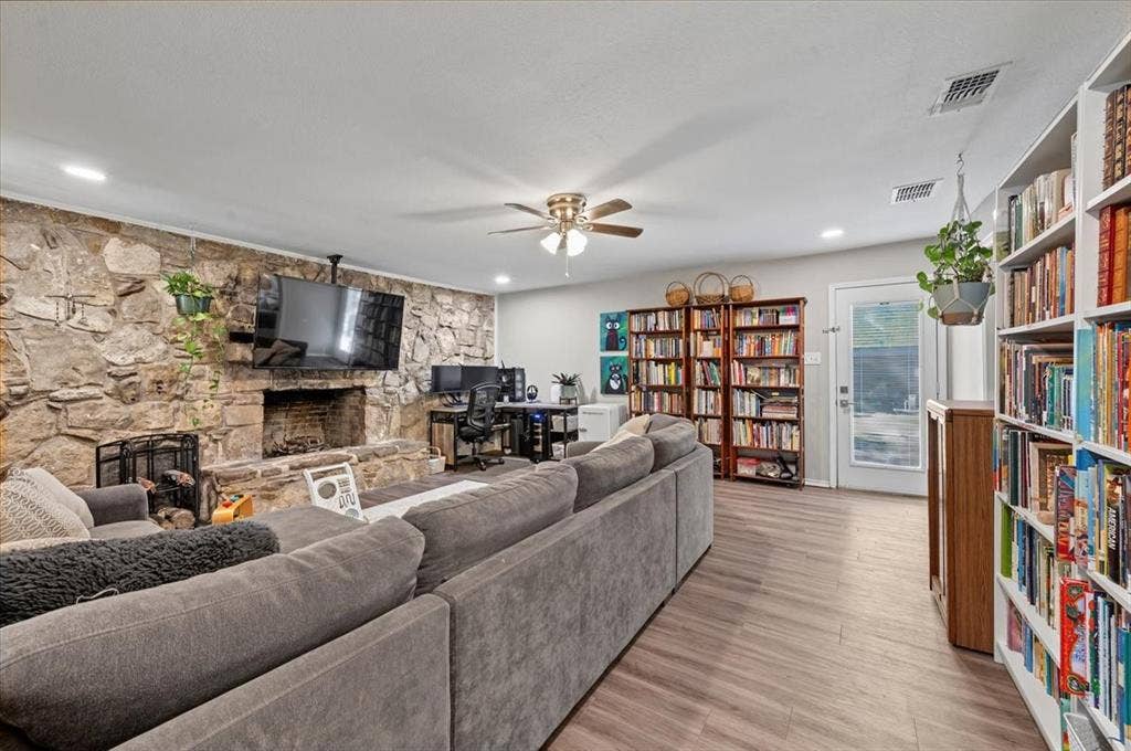 809 W Bridge Street, Weatherford, TX 76086 Stone accent wall with a built-in fireplace