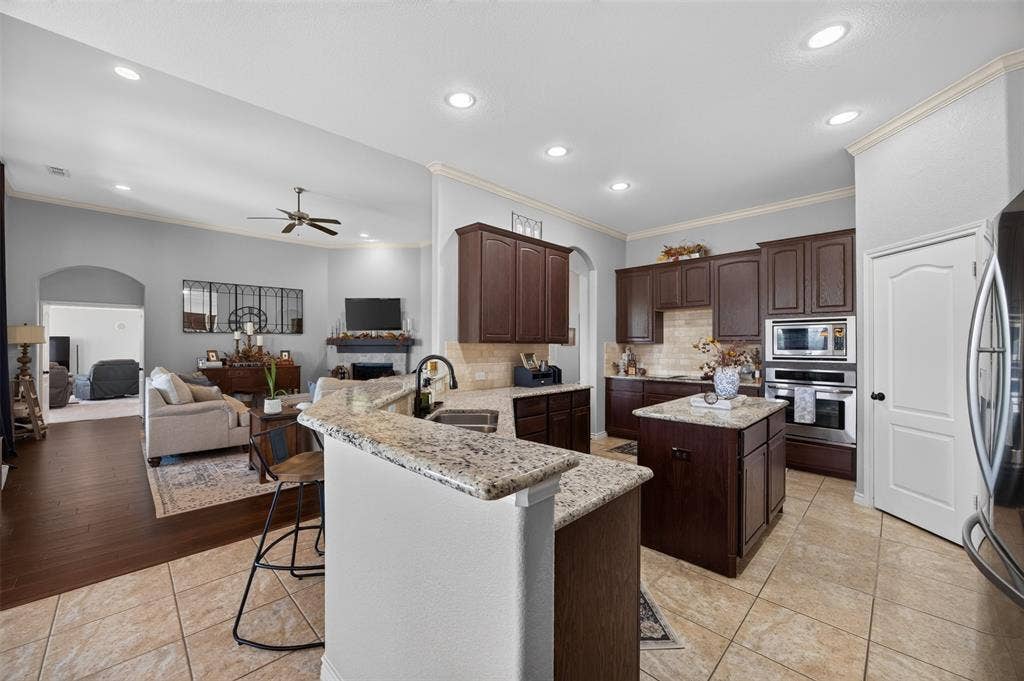 225 Diamond Rose Drive, Burleson, TX 76028 Granite kitchen with island and walk-in pantry