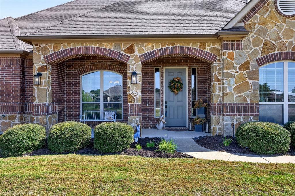 225 Diamond Rose Drive, Burleson, TX 76028 Brick and stone exterior with arched accents