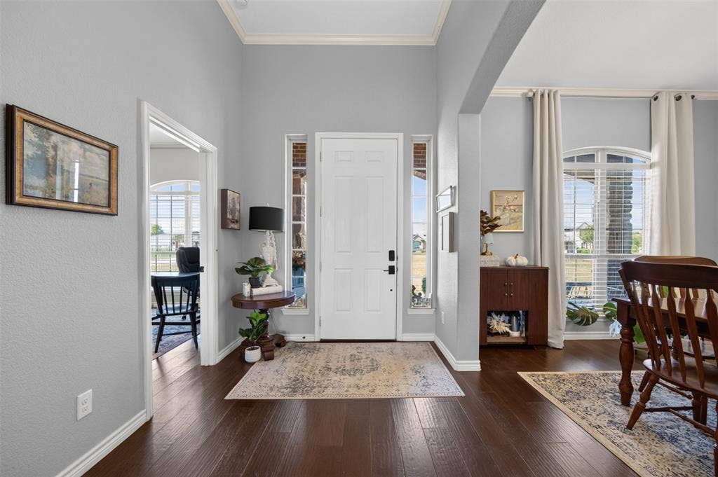 225 Diamond Rose Drive, Burleson, TX 76028 Entryway featuring dark wood-finish flooring, a white paneled door with sidelight windows, and light gray walls