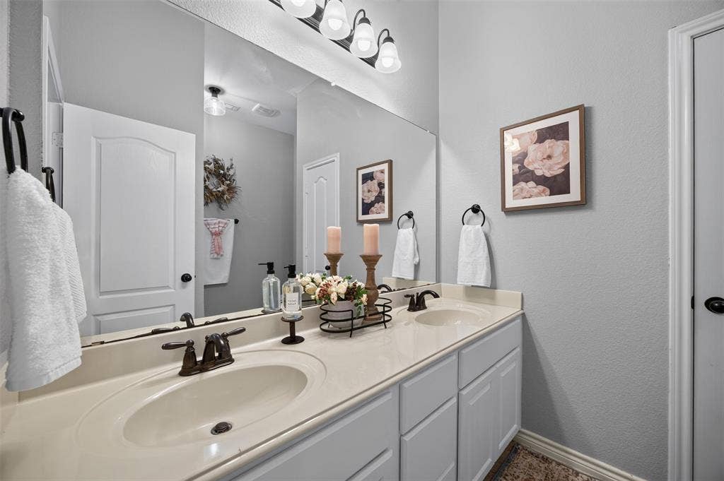 225 Diamond Rose Drive, Burleson, TX 76028 Bathroom with dual sinks and bathtub