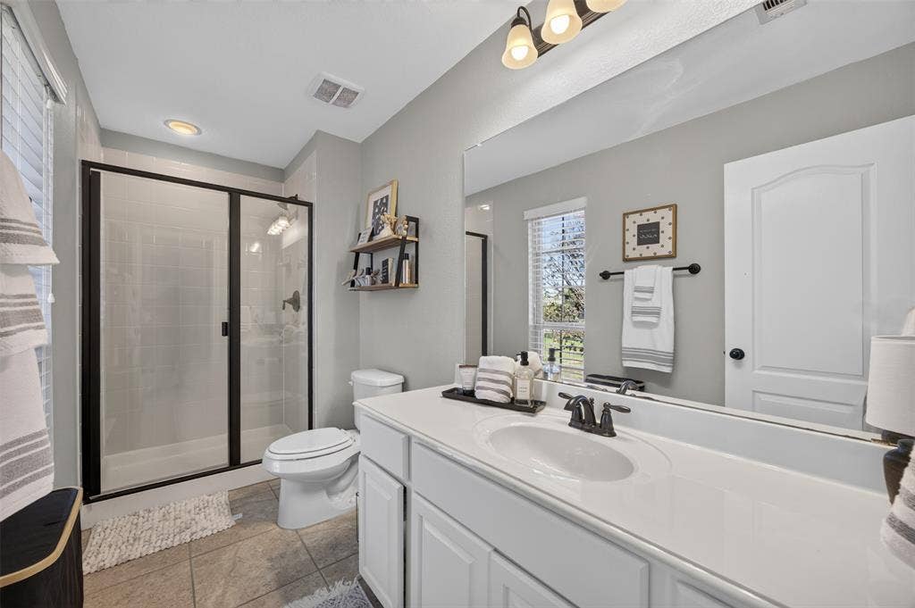 225 Diamond Rose Drive, Burleson, TX 76028 Second primary bath, private to the suite