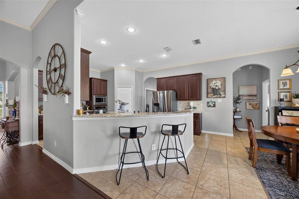 225 Diamond Rose Drive, Burleson, TX 76028 Breakfast bar on the sink peninsula