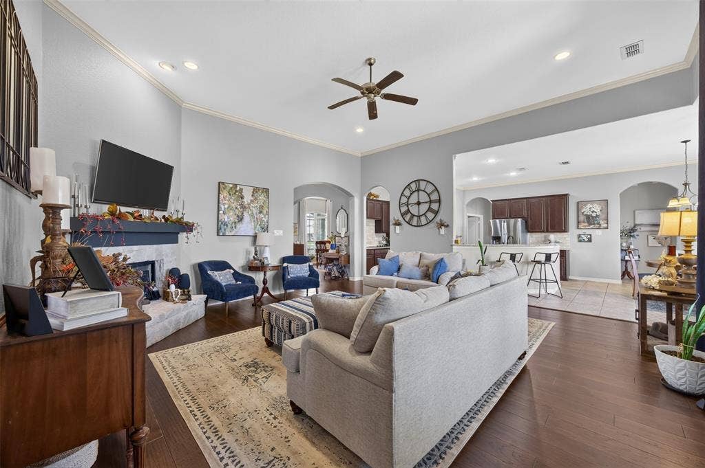225 Diamond Rose Drive, Burleson, TX 76028 20x20 living room with stone wood-burning fireplace