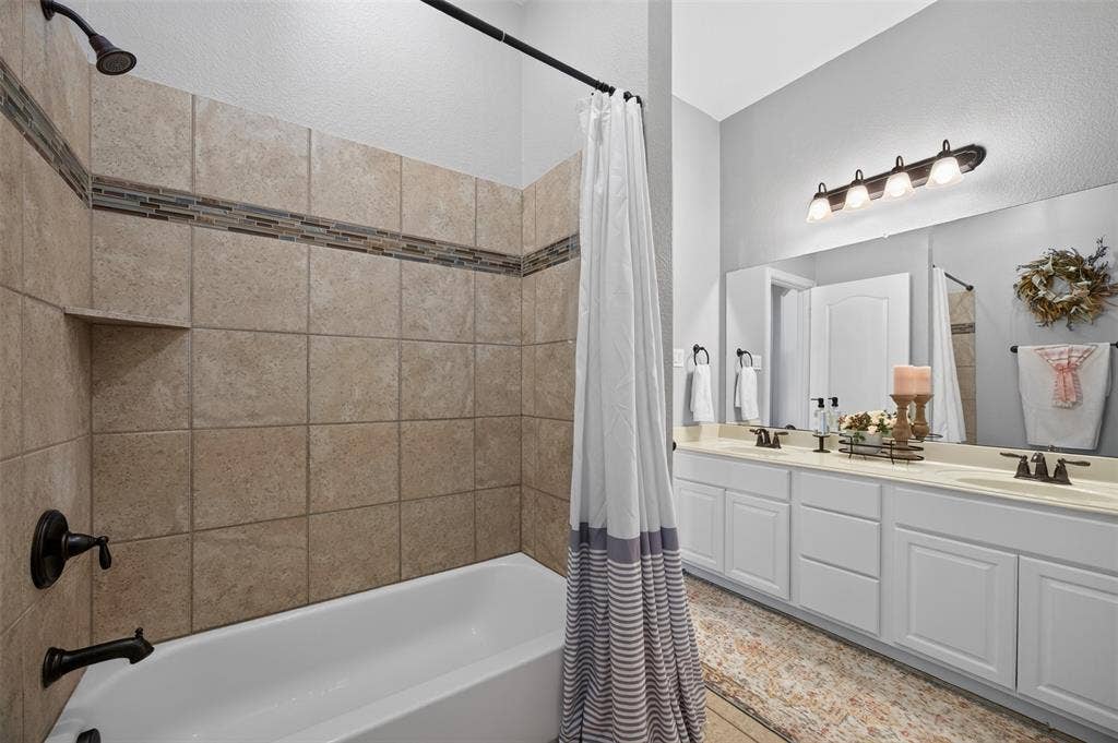 225 Diamond Rose Drive, Burleson, TX 76028 Full bathroom with dual sinks and tub