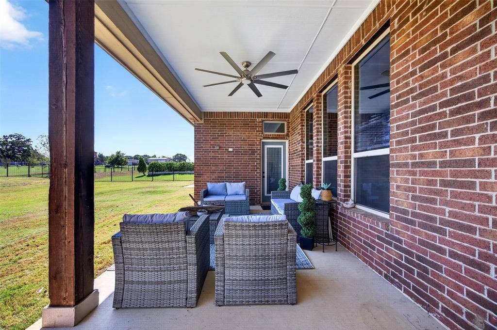 225 Diamond Rose Drive, Burleson, TX 76028 Covered back patio overlooking the acre