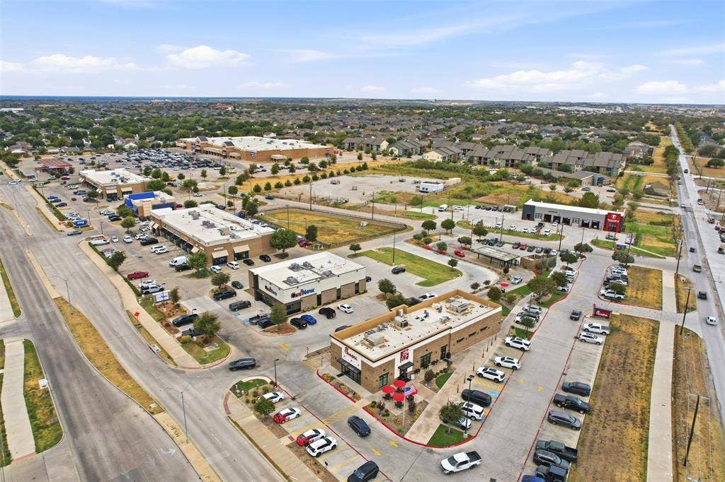 9005 Fescue Drive, Fort Worth, TX 76179 Commercial retail center with ample surface parking, multiple storefronts, and direct road access
