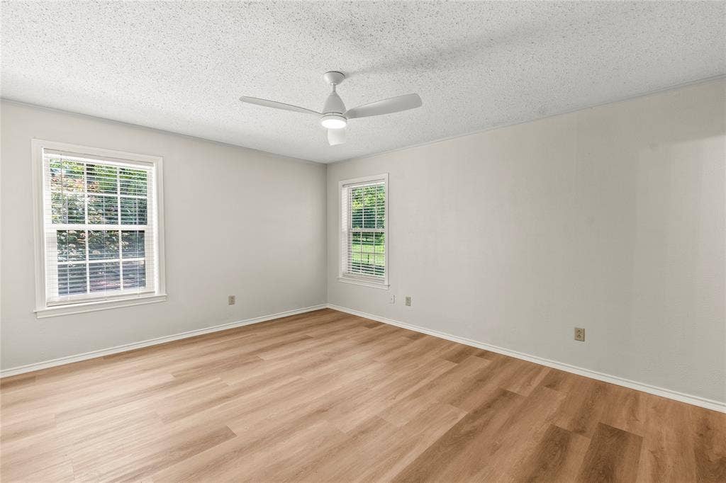 125 Harrell Street, Gun Barrel City, TX 75156 Bedroom 3 freshly painted with new ceiling fan, luxury vinyl plank flooring