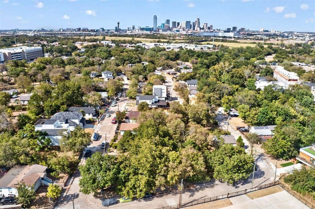 518 Crete Street, Dallas, TX 75203 Residential neighborhood with abundant mature trees and a distant cityscape