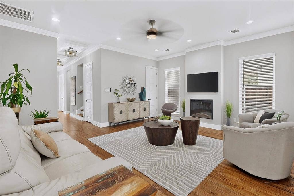 518 Crete Street, Dallas, TX 75203 Hardwood flooring, recessed lighting, crown molding, modern ceiling fan, and built-in fireplace