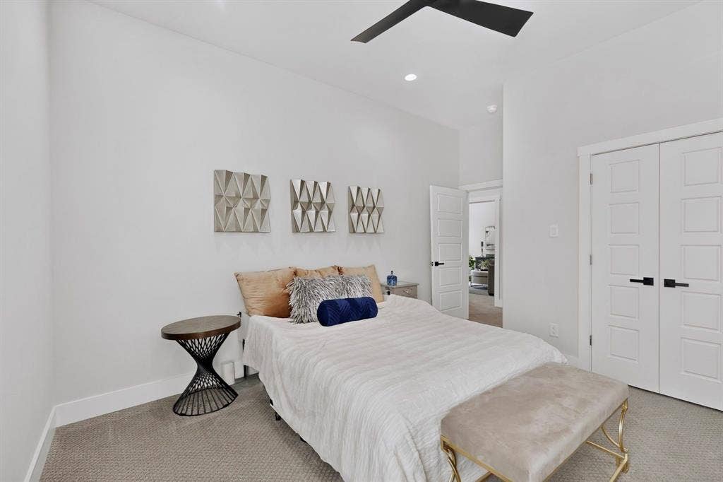 518 Crete Street, Dallas, TX 75203 Recessed lighting, ceiling fan, white paneled doors with black hardware, and gray carpet flooring