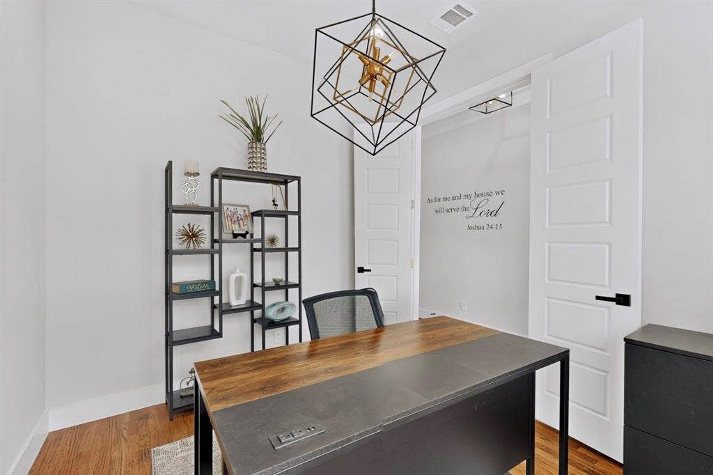 518 Crete Street, Dallas, TX 75203 Wood-finish flooring, white walls, and a modern geometric light fixture