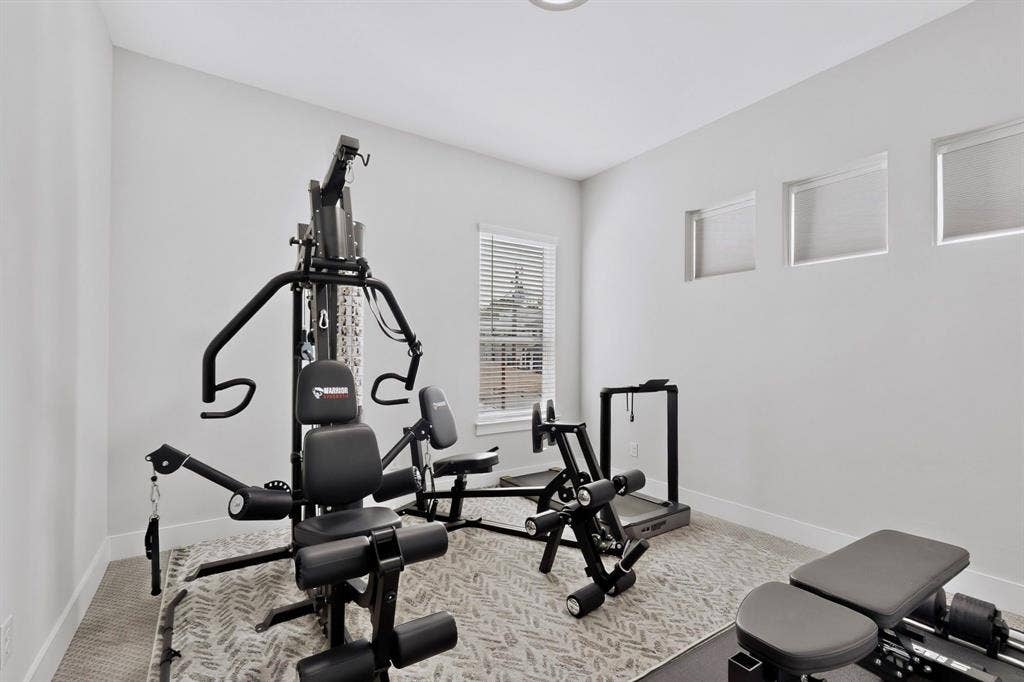 518 Crete Street, Dallas, TX 75203 Recessed lighting, wall-to-wall carpeting, and a window with blinds