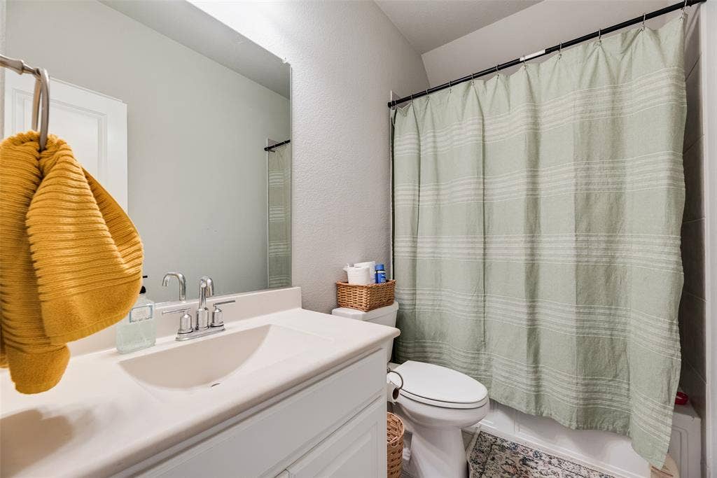 718 Waterbrook Parkway, Argyle, TX 76226 Integrated single-basin vanity with polished chrome faucet and frameless mirror