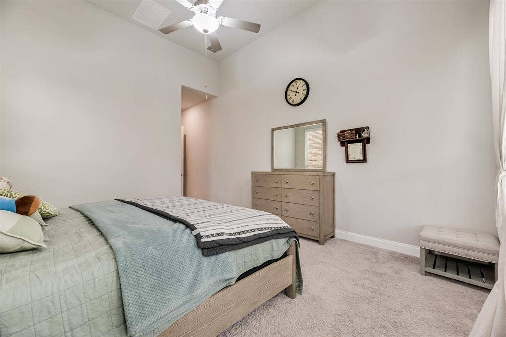 718 Waterbrook Parkway, Argyle, TX 76226 Vaulted ceiling with a ceiling fan, light-colored carpet, and a neutral wall palette
