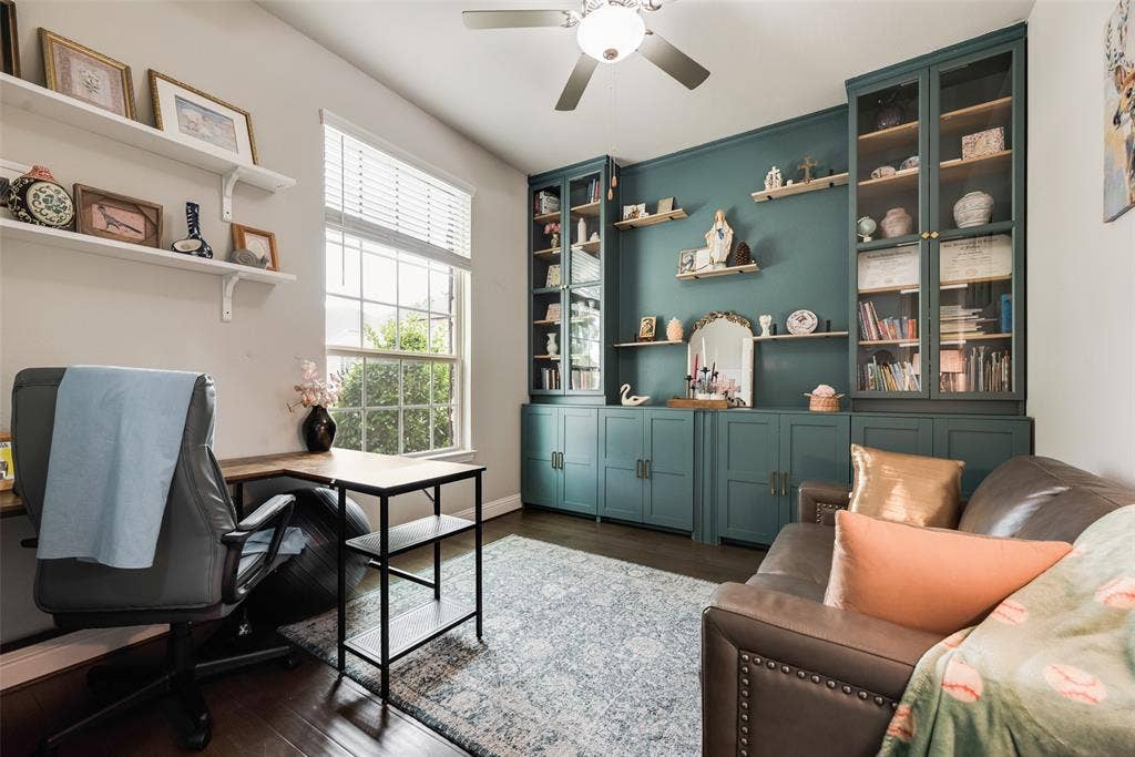 718 Waterbrook Parkway, Argyle, TX 76226 Vaulted ceiling with a ceiling fan, a window with blinds, dark wood-finish flooring, and built-in cabinetry with glass-front uppers